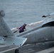 U.S. Sailor prepares to fuel an aircraft