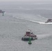 Tugboats approach the aircraft carrier USS John C. Stennis (CVN 74)