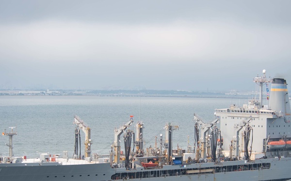 The underway replenishment oiler USNS Patuxent (T-AO-201) steams past