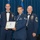 Airman Leadership School distinguished graduate Three United States Air Force personnel pose for a formal photo at what appears to be an Airman Leadership School graduation ceremony. The central figure, identified on the diploma as SrA Jimmy M. Pham, holds a framed diploma from the United States Air Force Airman Leadership School. He is flanked by two senior non-commissioned officers in formal mess dress uniforms.
