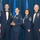 Airman Leadership School academic achievement Four U.S. Air Force personnel pose for a formal group photo at what appears to be a military awards ceremony or banquet. A female airman in the center holds a trophy or award figurine, suggesting she is being recognized for an achievement. The attendees are dressed in formal military dress uniforms and mess dress attire.