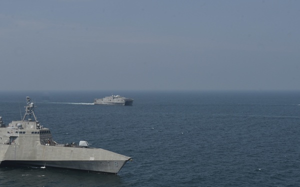 U.S. Navy and Coast Guard Sail in formation with the Malaysian Navy and Coast Guard
