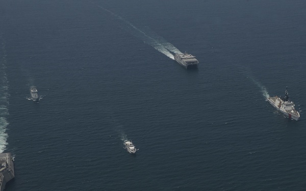 U.S. Navy and Coast Guard Sail in formation with the Malaysian Navy and Coast Guard