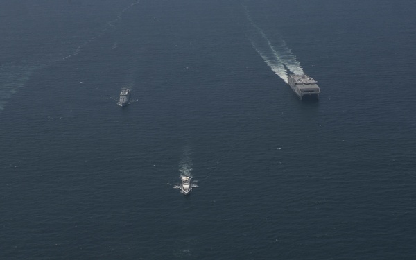 U.S. Navy and Coast Guard Sail in formation with the Malaysian Navy and Coast Guard