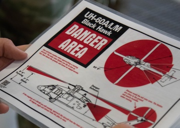 Army firefighters review UH-60 Black Hawk safety information
