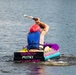 Airmen participate in a cardboard regatta