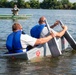 Airmen participate in a cardboard regatta