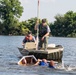 Airmen participate in a cardboard regatta