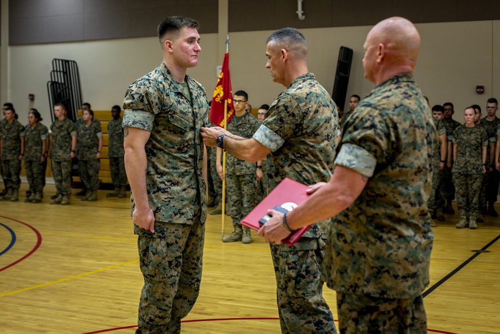 Col. James L. Shelton Jr. awards Lance Cpl. Braxton A. Goff with a Navy Achievement Medal