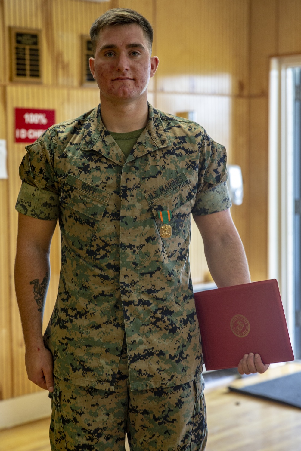 Col. James L. Shelton Jr. awards Lance Cpl. Braxton A. Goff with a Navy Achievement Medal