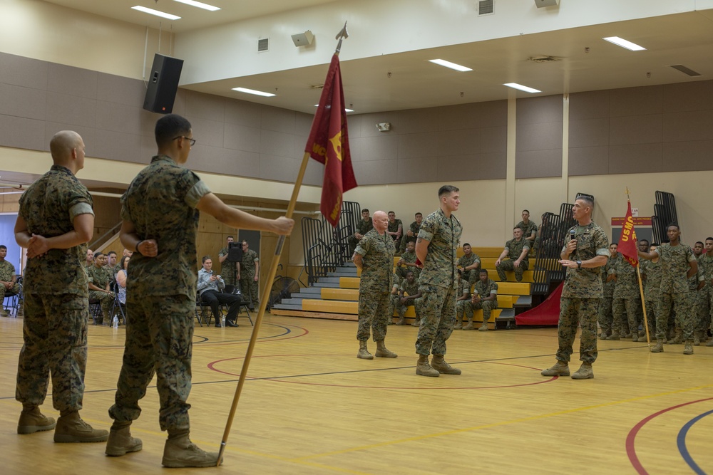 Col. James L. Shelton Jr. awards Lance Cpl. Braxton A. Goff with a Navy Achievement Medal