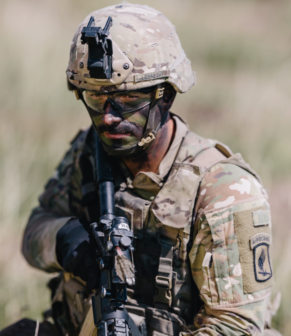 U.S. Army paratrooper waits for orders to execute fire mission