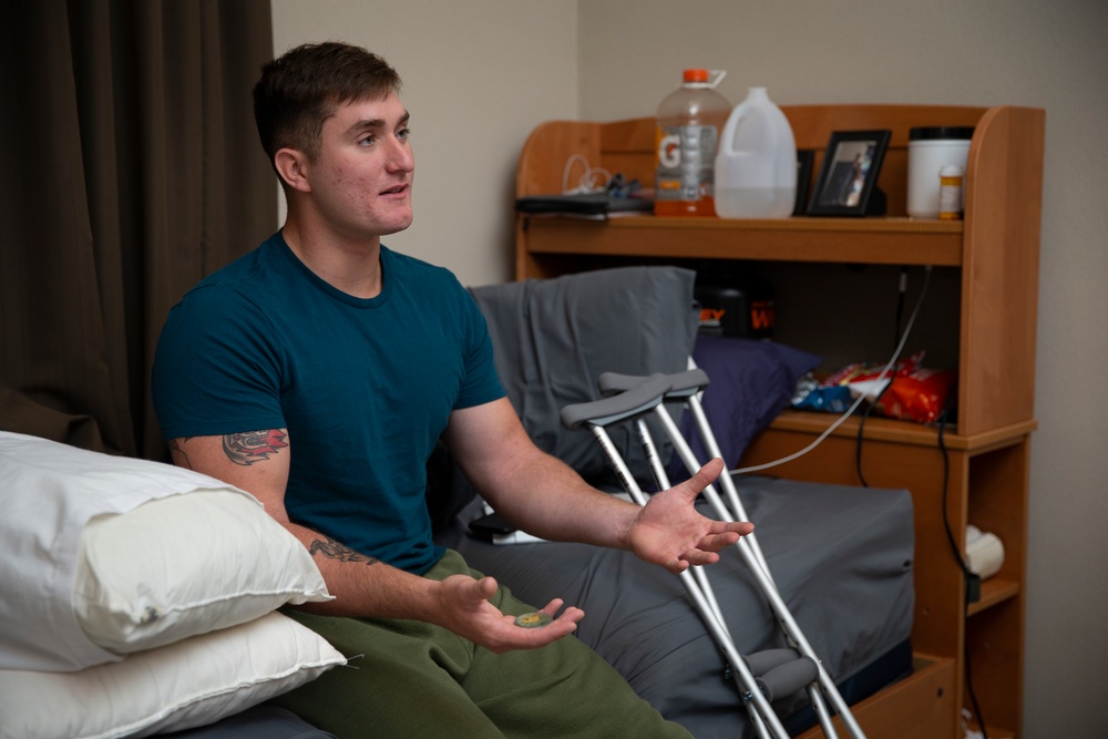 Col. James L. Shelton Jr. visits and awards Lance Cpl. Braxton Goff with the Marine Corps Combat Service Support Schools Challenge Coin For Exceptional Performance