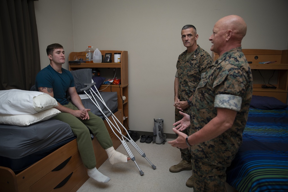 Col. James L. Shelton Jr. visits and awards Lance Cpl. Braxton Goff with the Marine Corps Combat Service Support Schools Challenge Coin For Exceptional Performance