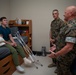 Col. James L. Shelton Jr. visits and awards Lance Cpl. Braxton Goff with the Marine Corps Combat Service Support Schools Challenge Coin For Exceptional Performance