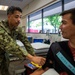 Corpsman helps patient
