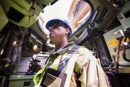 Inspecting a Bradley Fighting Vehicle
