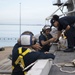 U.S. Sailors conduct routine maintenance on the aircraft carrier USS John C. Stennis