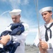 U.S. Navy Sailors lower the Union Jack