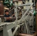 U.S. Sailor transfers liquid oxygen to a cryogenic pump
