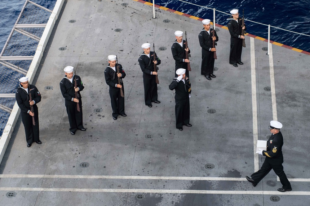 U.S. Sailors participate in a burial at sea