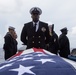 U.S. Navy Master Chief Operation’s Specialist Mark Bell, from Birmingham, Alabama, stands at parade rest during a burial at sea