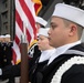 U.S. Navy Aviation Electronics Technician 3rd Class Cyrille Somera, from Murrieta, California, stands at attention during a burial at sea