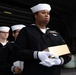 U.S. Navy Logistics Specialist 3rd Class Jasilyn Quinones, from Baton Rouge, Louisiana, holds an urn during a burial at sea