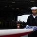 U.S. Navy Religious Programs Specialist 2nd Class Che’lese Bowman, from Clover, Virginia, folds the American flag during a burial at sea