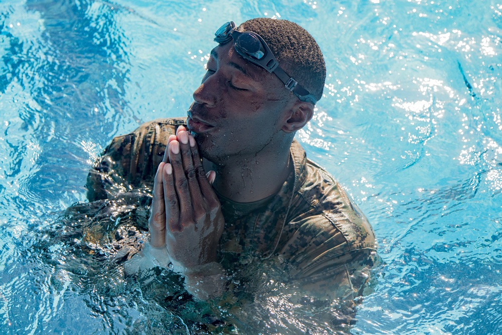 Martial arts instructor hopefuls complete pool workout