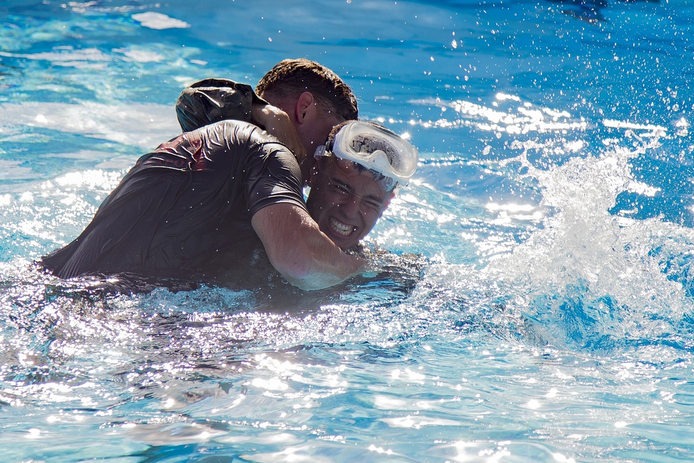 Martial arts instructor hopefuls complete pool workout