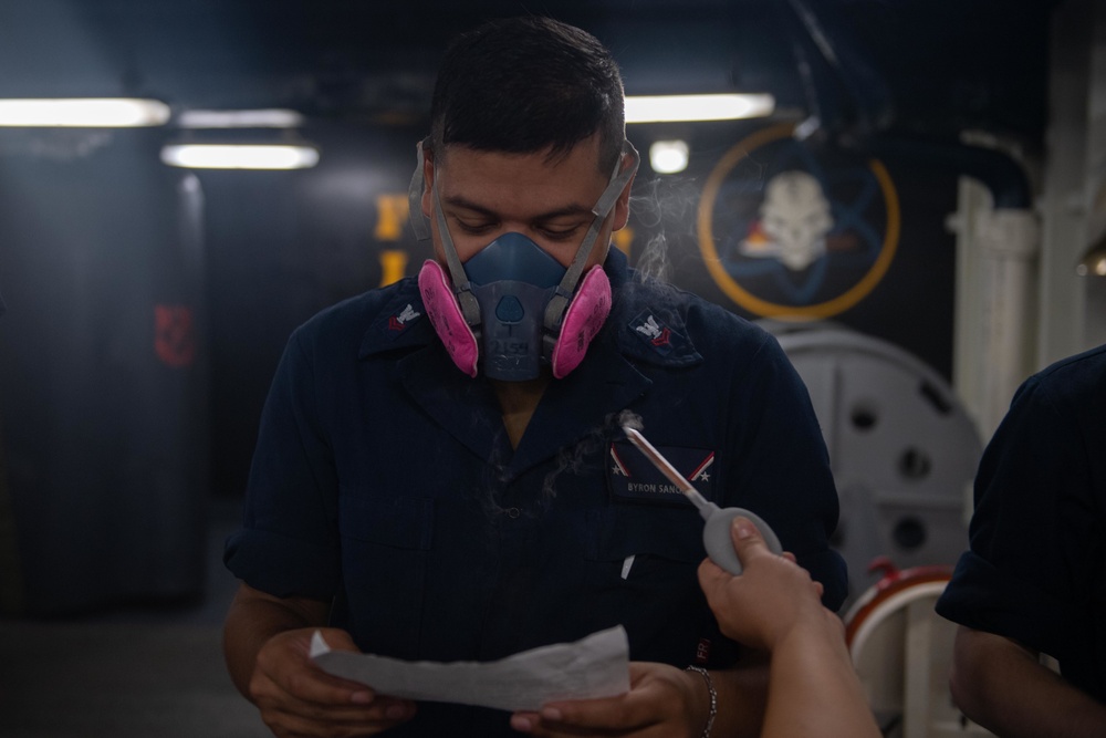 U.S. Navy Sailor tests respirator fit aboard aircraft carrier USS John C. Stennis