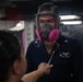 U.S. Navy Sailor tests respirator fit aboard aircraft carrier USS John C. Stennis