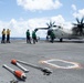U.S. Sailors direct a C-2A Greyhound, assigned to Fleet Logistics Combat Support Squadron (VRC) 40, on the flight deck