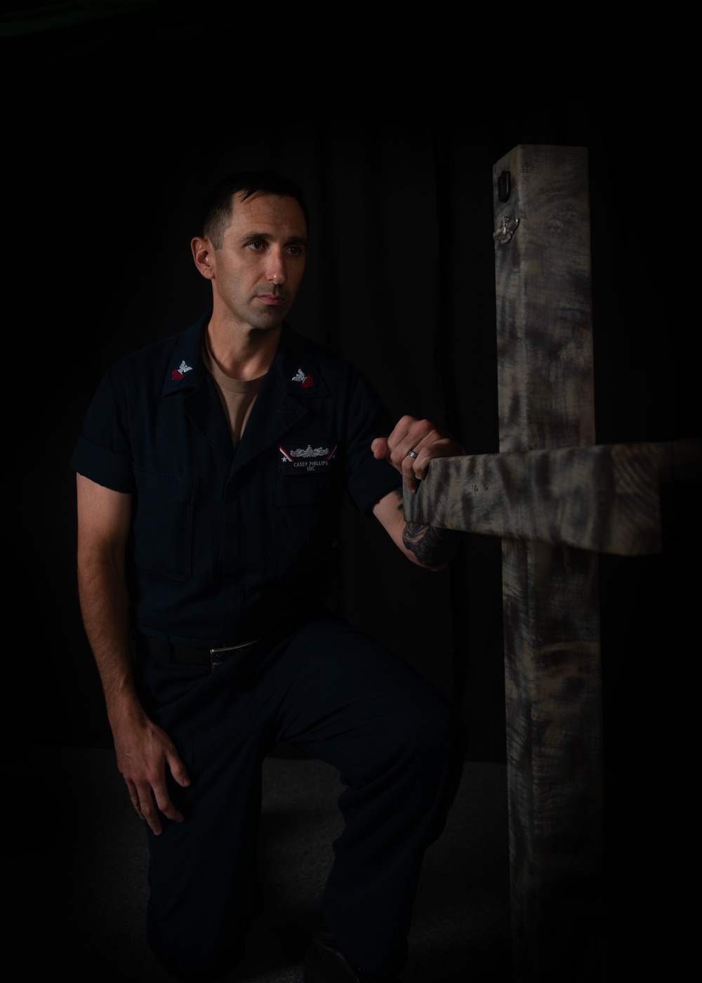 U.S. Navy Hospital Corpsman 1st Class Casey Phillips, from Peoria, Arizona, poses for a portrait