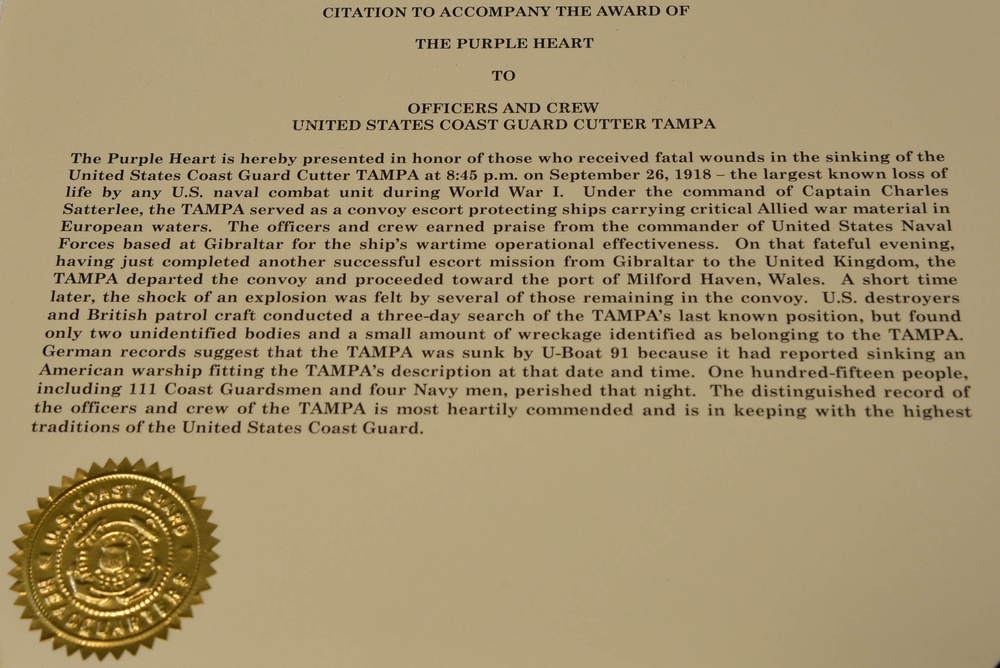 Coast Guard presents Purple Heart to USS Tampa families