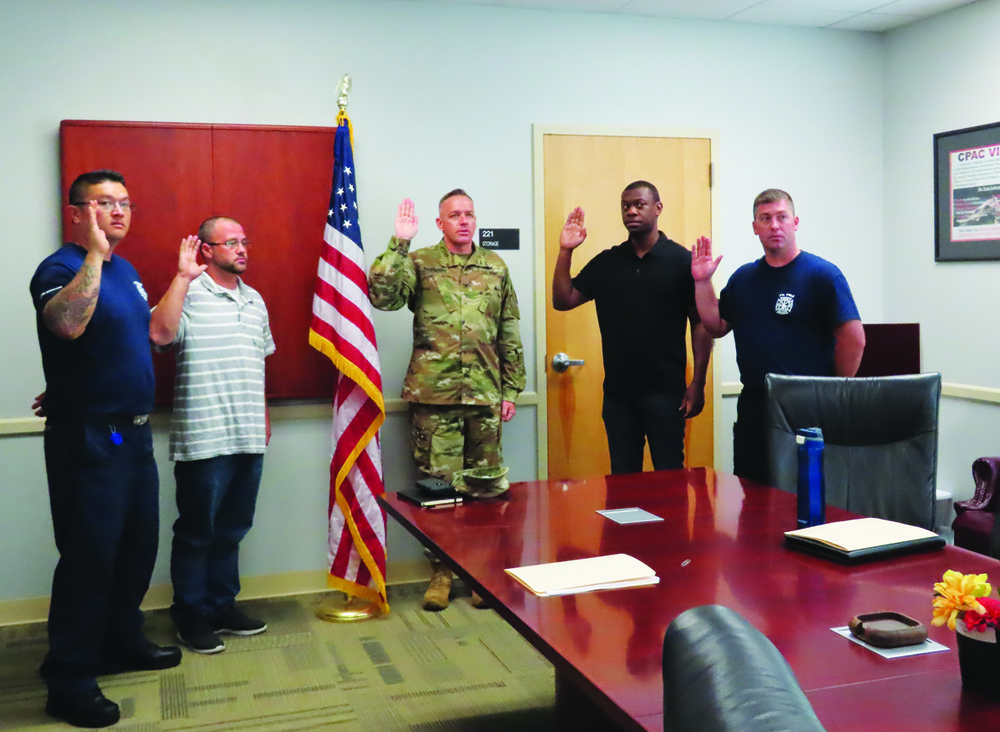 New hires attend in processing, take oath before starting new jobs
