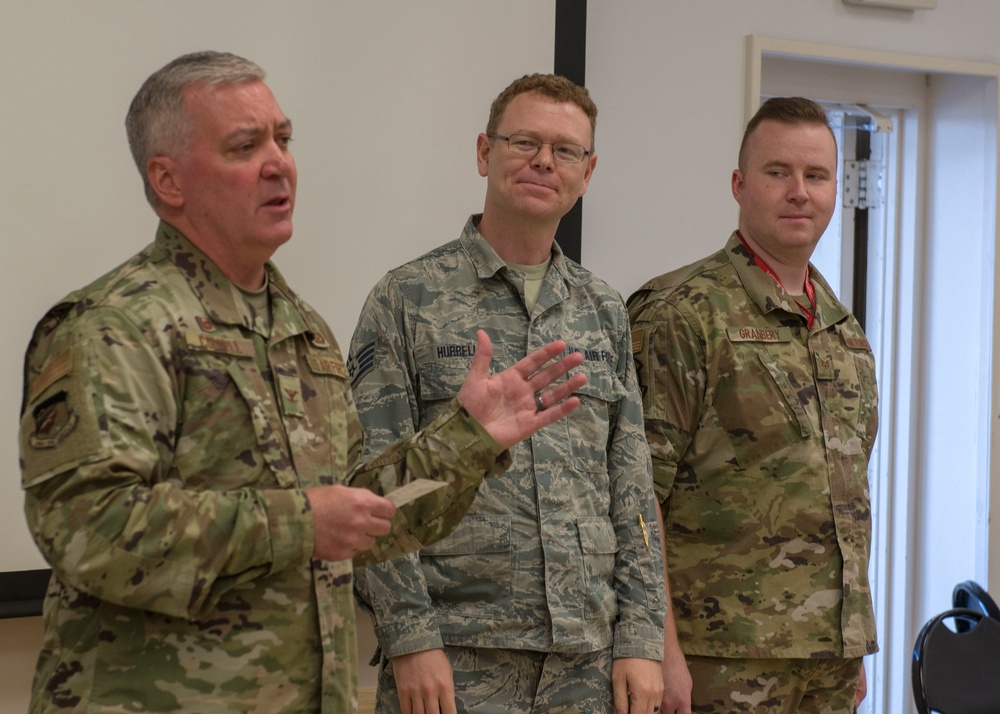 Airmen from the 202nd ISRG get coined at Otis ANGB