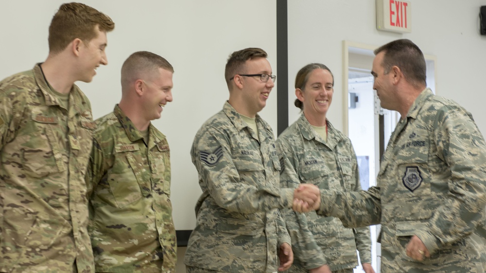 Airmen from the 202nd ISRG get coined at Otis ANGB