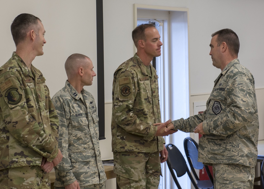 Airmen from the 202nd ISRG get coined at Otis ANGB