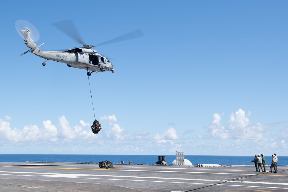 U.S. Sailors assigned to Helicopter Sea Combat Squadron (HSC) 9, conduct a vertical replenishment-at-sea exercise from an MH-60S Sea Hawk