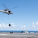 U.S. Sailors assigned to Helicopter Sea Combat Squadron (HSC) 9, conduct a vertical replenishment-at-sea exercise from an MH-60S Sea Hawk
