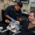 U.S. Sailor draws blood from patient