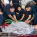 U.S. Sailors tend to a simulated patient during a mass casualty dril