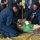 U.S. Sailors tend to a simulated patient during a mass casualty dril