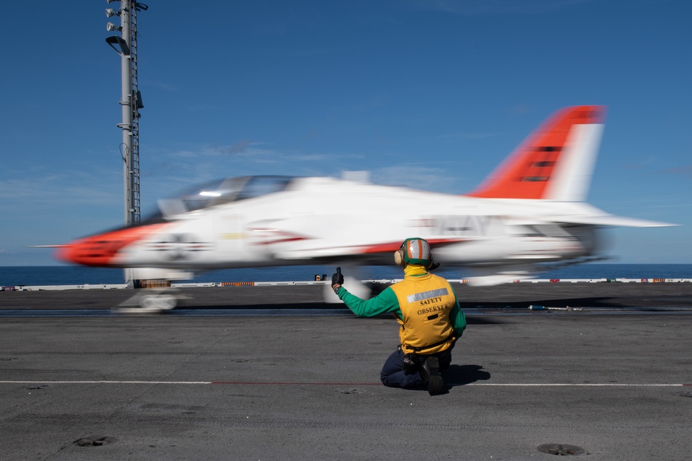 DVIDS - Images - U.S. Sailor directs a T-45C Goshawk jet attached to Chief  of Naval Air Training Command for launch off the flight deck of the  aircraft carrier USS John C.