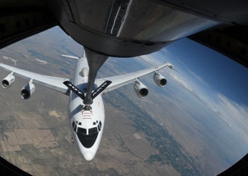 U.S. Navy E-6B Mercury refuels in a turn