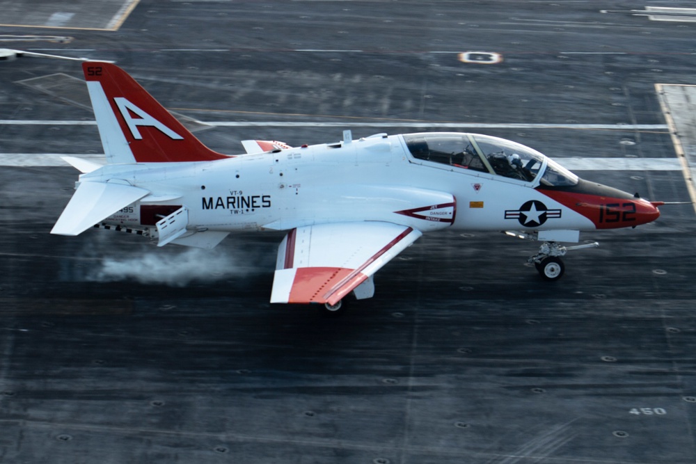 A T-45C Goshawk training aircraft, assigned to Training Air Wing (TW) 1, performs a touch-and-go on the flight deck of the aircraft carrier USS John C. Stennis
