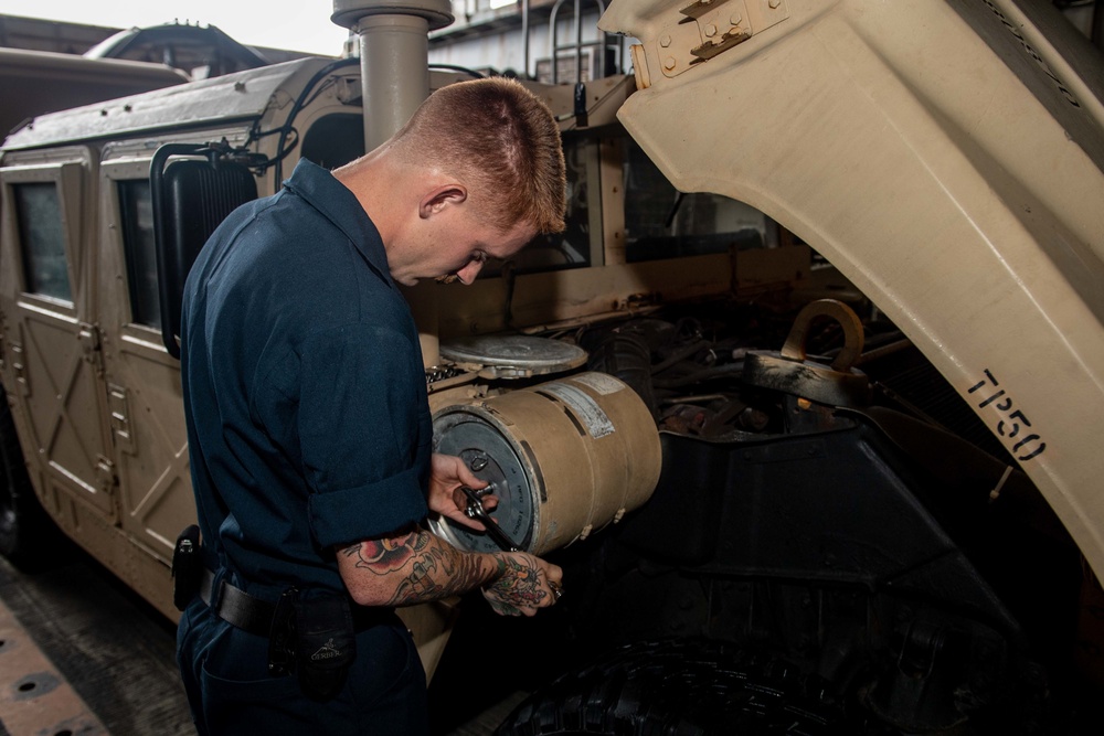 U.S. Navy Sailor Conducts Maintenance