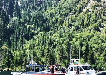 Coast Guard Station Lake Tahoe and El Dorado Sherriff's Department crews interact with a suspected illegal charter vessel
